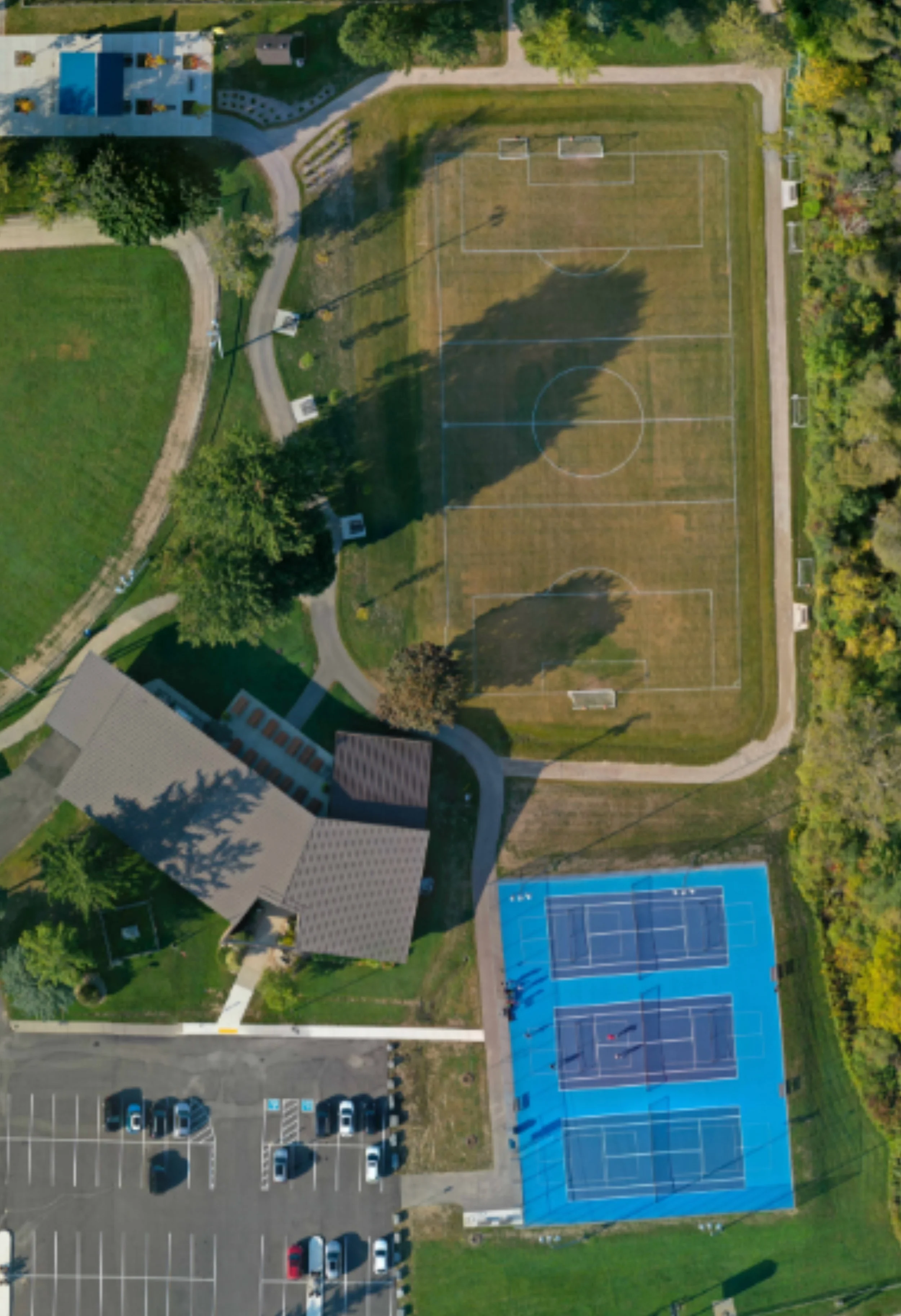 Community park construction with playground and tennis courts in Ontario