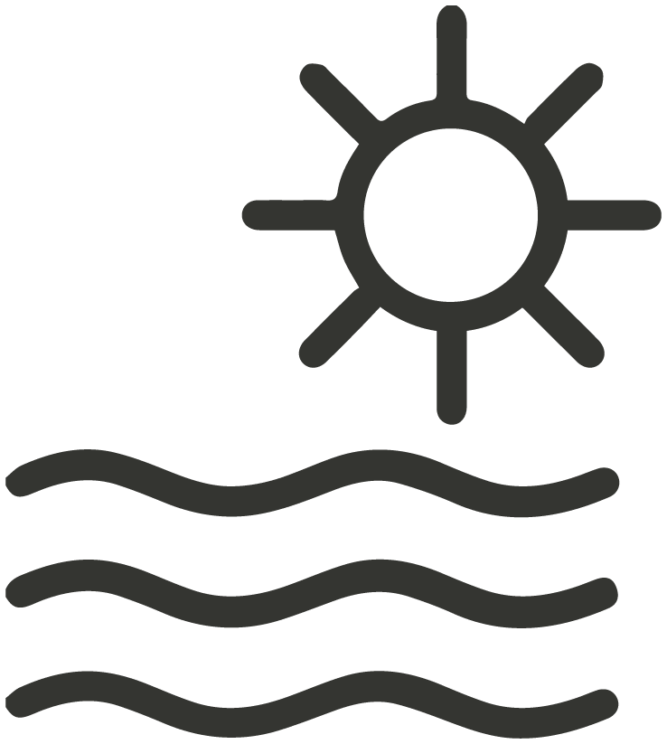 Sun shining over water with waves.