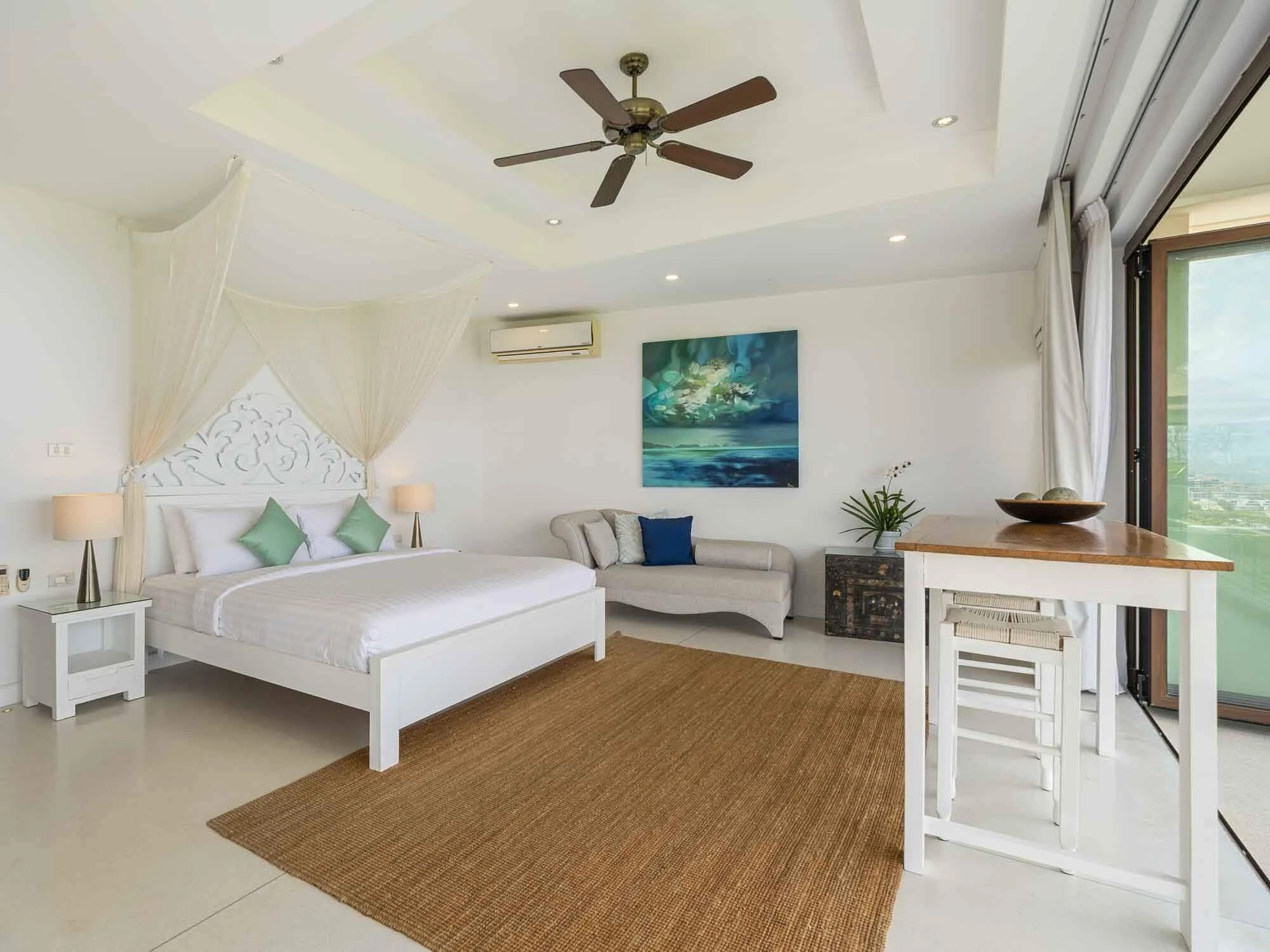 Bright bedroom suite interior at Saensook eco villa Koh Samui with expansive floor-to-ceiling glass doors opening to panoramic ocean views