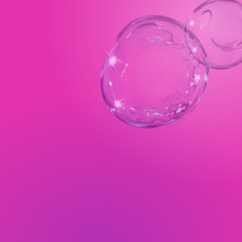 Close-up of two transparent bubbles against a pink background.