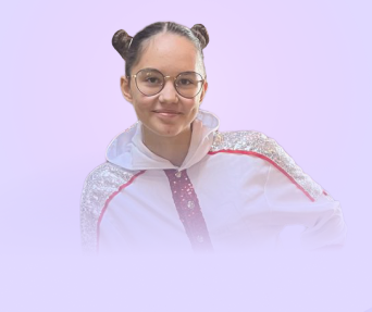 A young woman with glasses and double buns hairstyle, wearing a shiny white jacket with pink accents, against a light purple background.
