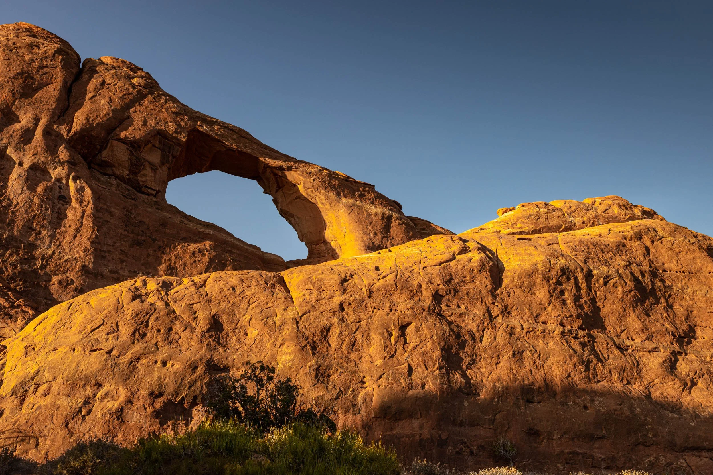  Skyline Glow 
This shot captures the exact moment my patience paid off during a spectacular desert sunset. I stood waiting by my tripod watching the shadows slowly stretch across the canyon floor. Right on cue during peak golden hour, the setting su