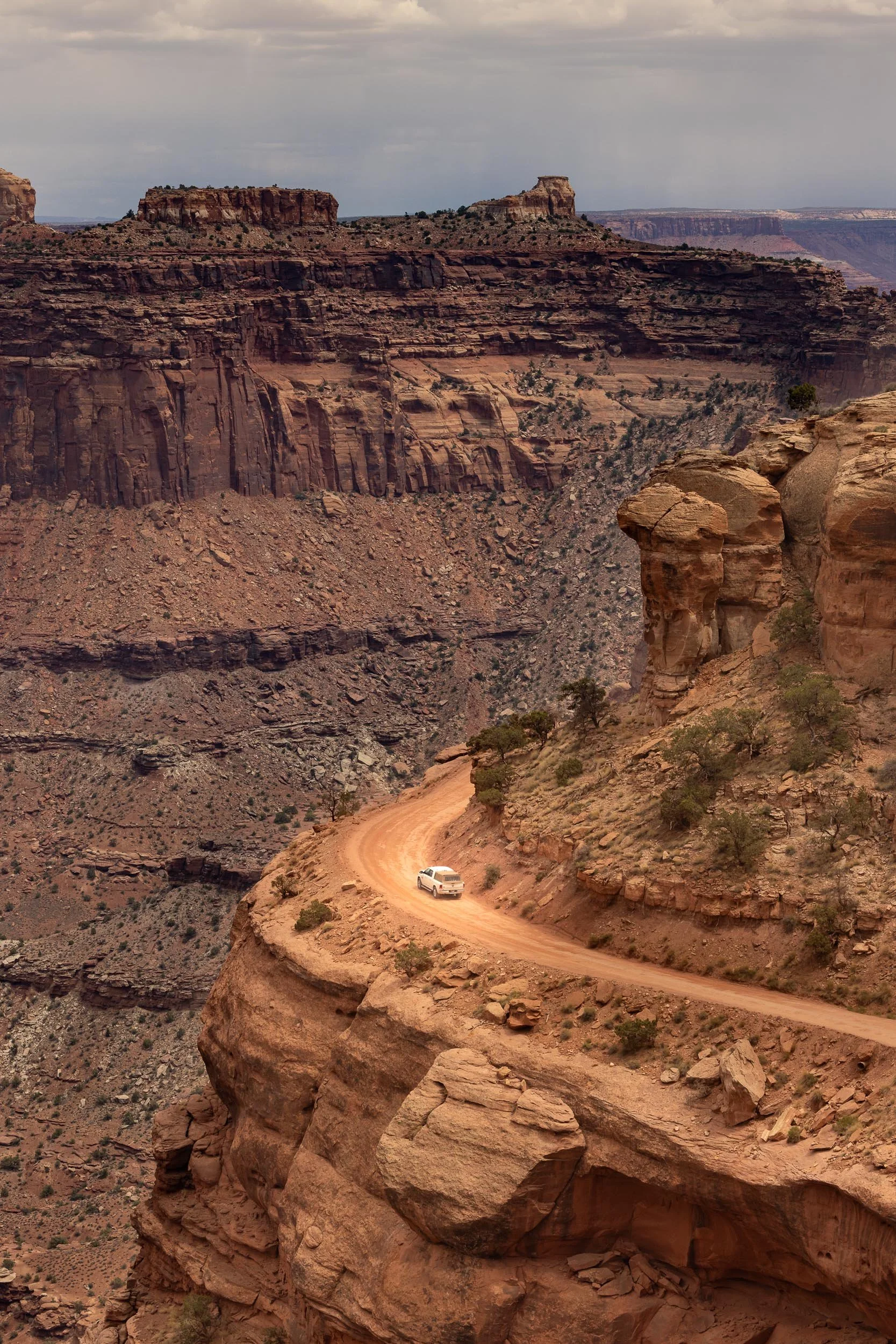  On the Edge 
Perched precariously between a towering rock wall and a sheer drop, this narrow dirt track pushes you right to the brink of fear and exhilaration. Looking down into the endless, sun-baked abyss forces an immediate, heart-pounding awaren