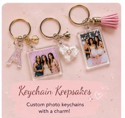Three custom photo keychains with charms, each featuring a picture of two women, set on a pink background with a pink card reading "Keychain Keepsakes" and a description of custom photo keychains.