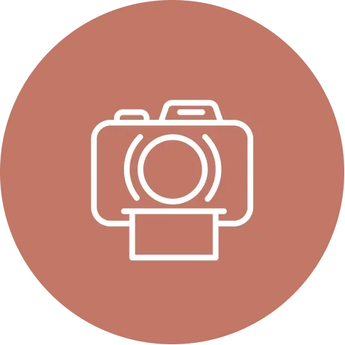 Icon of a camera on a brown circular background.