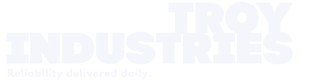 Troy Industries logo with the slogan 'Reliability delivered daily.' in white text on a black background.