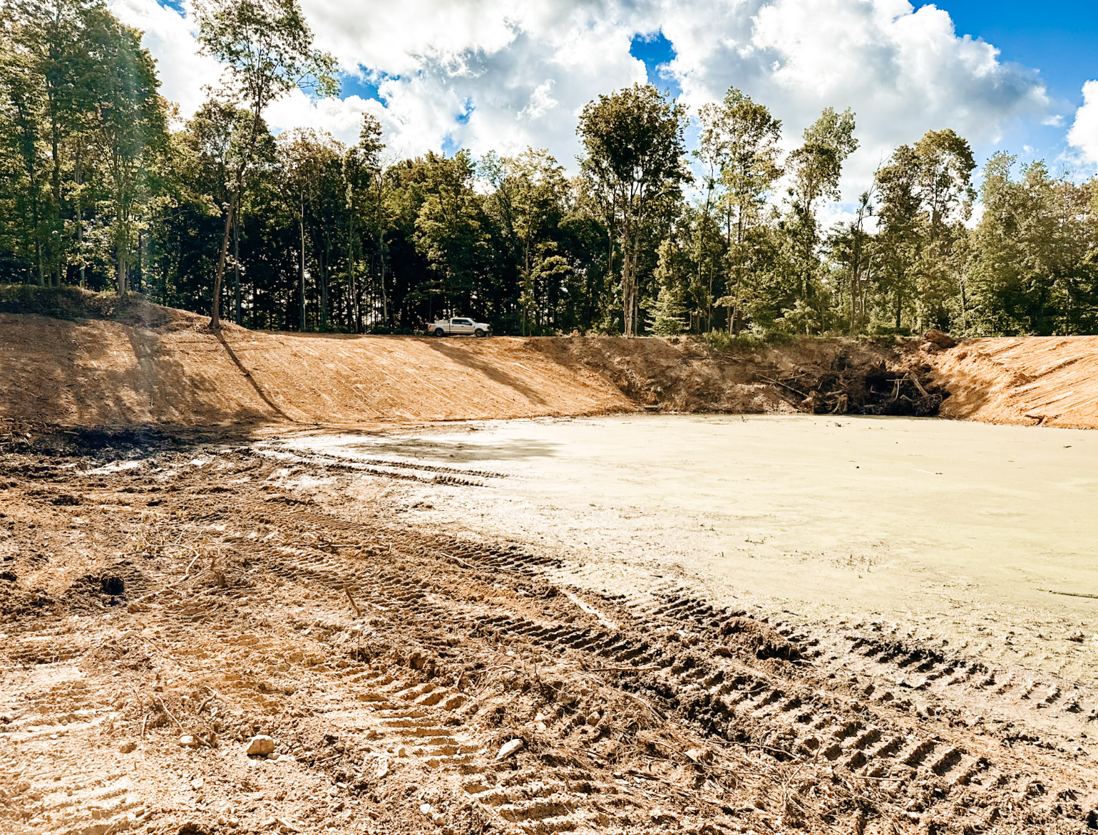 Professional land clearing, excavation, forestry mulching, grading, driveway installation, drainage solutions, and site preparation by Logan Earthworks in Akron, OH.