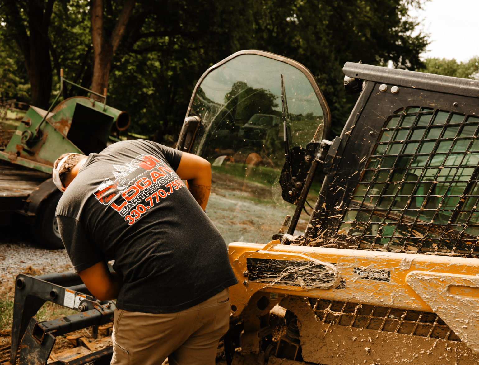 Professional land clearing, excavation, forestry mulching, grading, driveway installation, drainage solutions, and site preparation by Logan Earthworks in Canfield, OH.