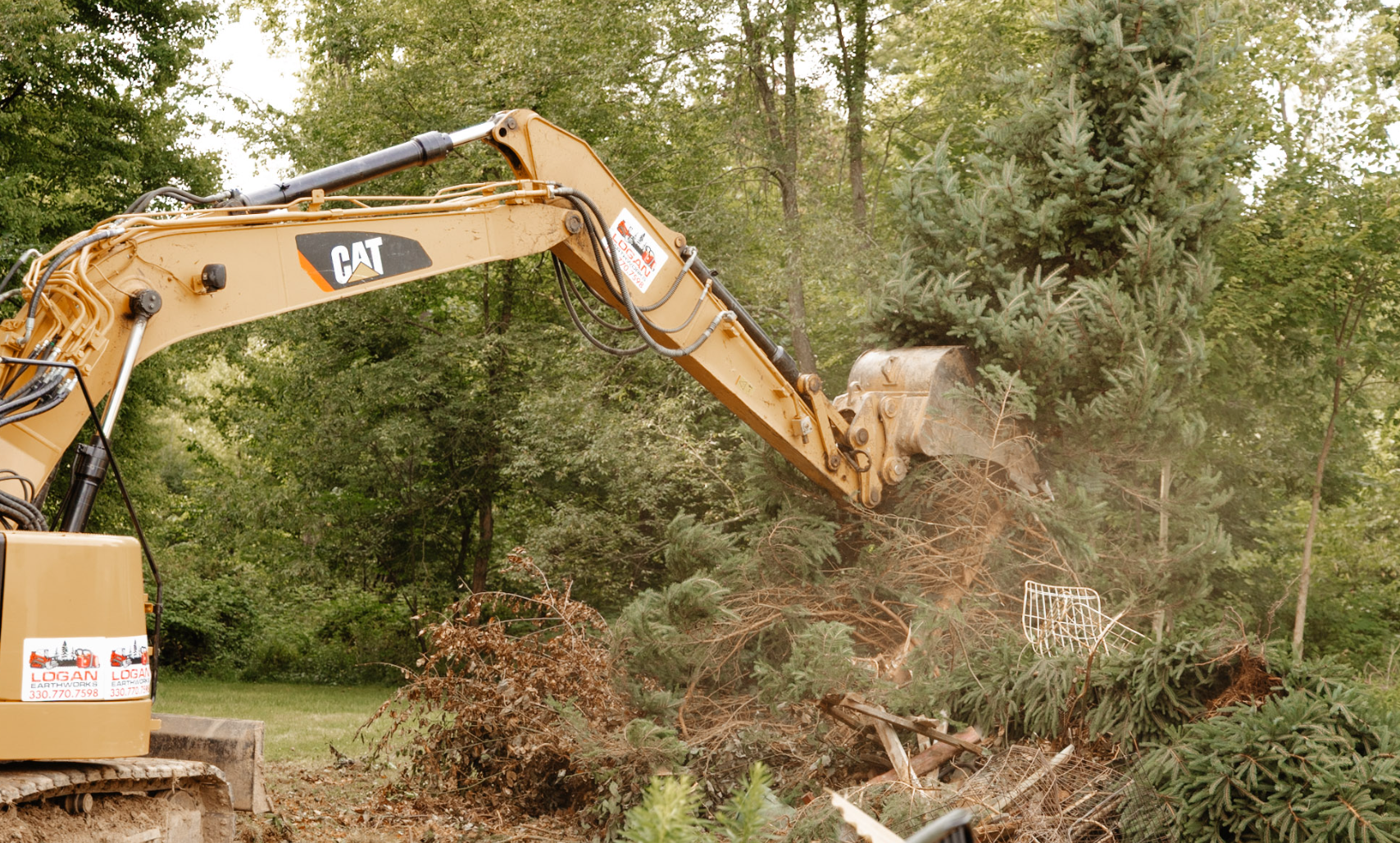 Professional land clearing, excavation, forestry mulching, grading, driveway installation, drainage solutions, and site preparation by Logan Earthworks in Cranberry Township, PA.