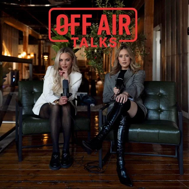 Ciara Yaschuk and Lisa Macgregor sitting on green sofas in a cozy wooden interior, recording a podcast or talk show with microphones, and a red sign overhead that says 'Off Air Talks'.
