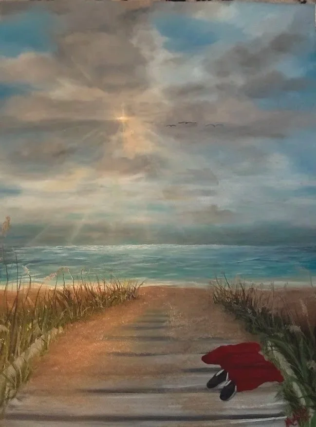 Painting of a sandy path leading to the ocean under a cloudy sky with sunlight breaking through, a red cloth and black shoes on the path, and grasses on each side.