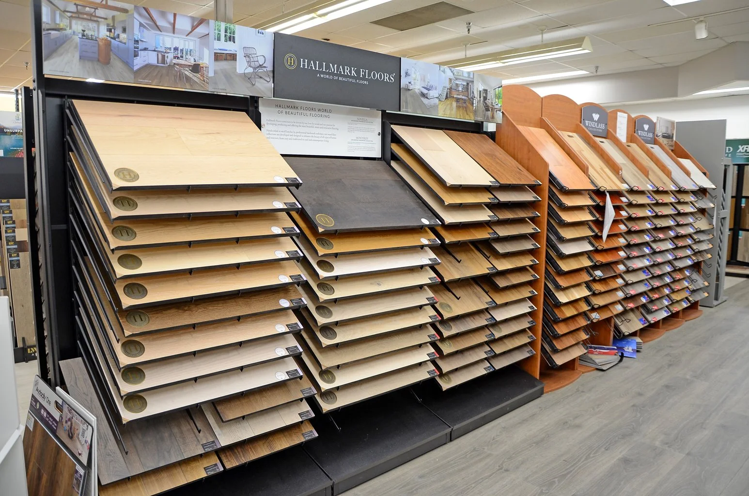 Display of various wood flooring samples in a home improvement store.