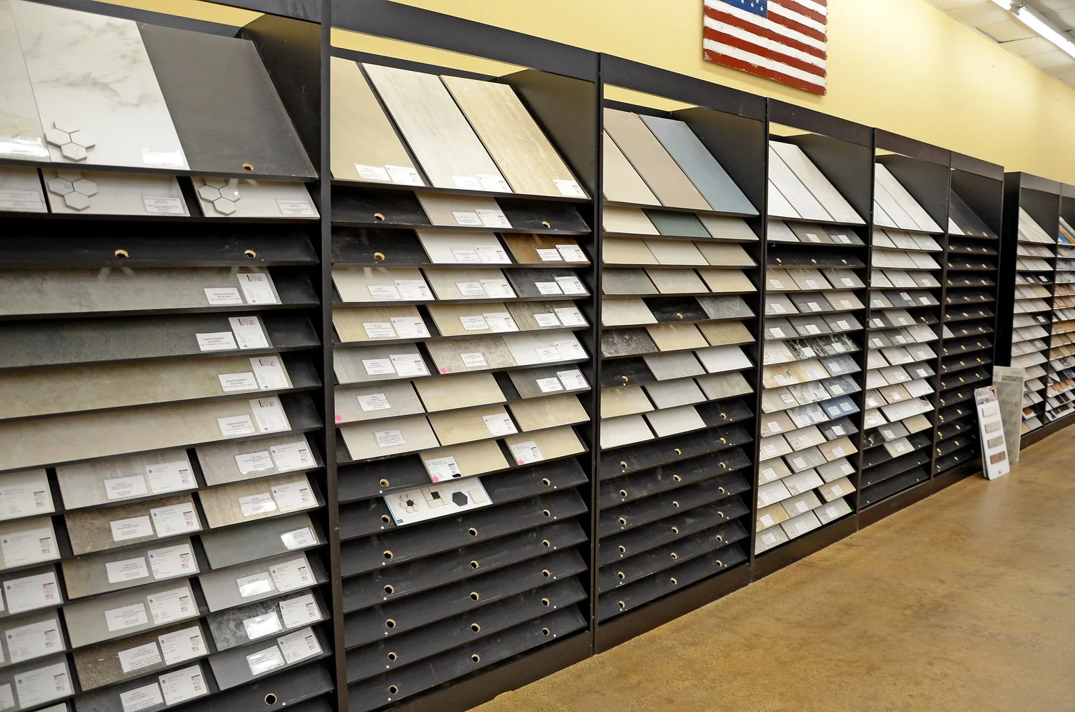 Display of various tile samples in a showroom.