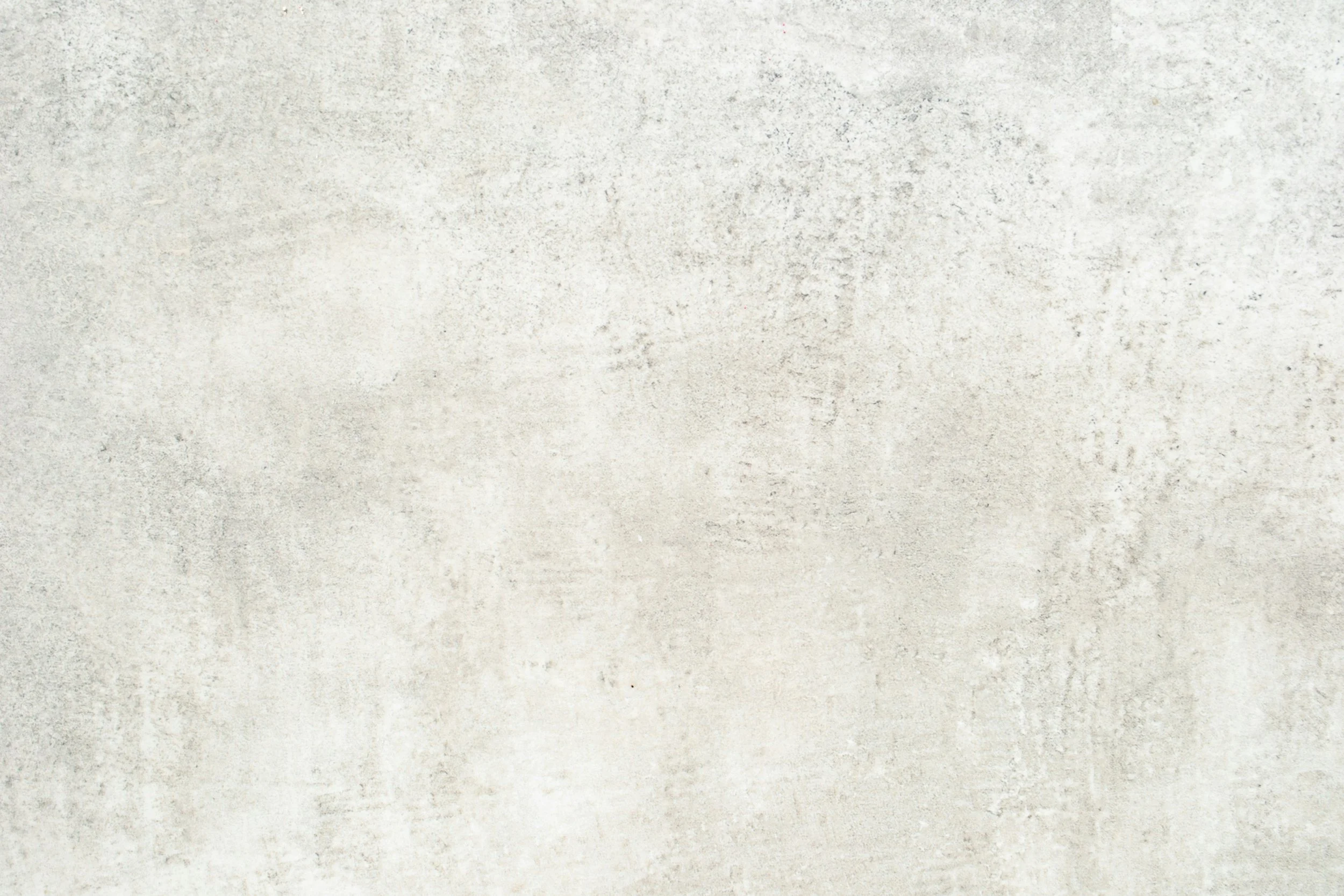 Empty textured light gray wall.