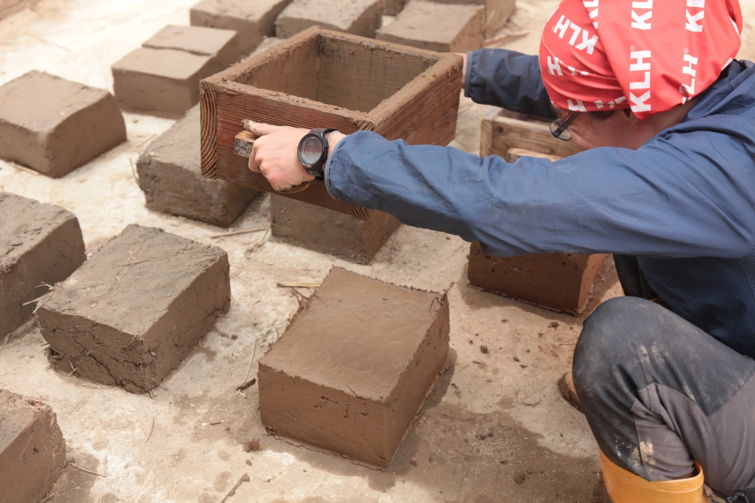 Unmolding mud bricks