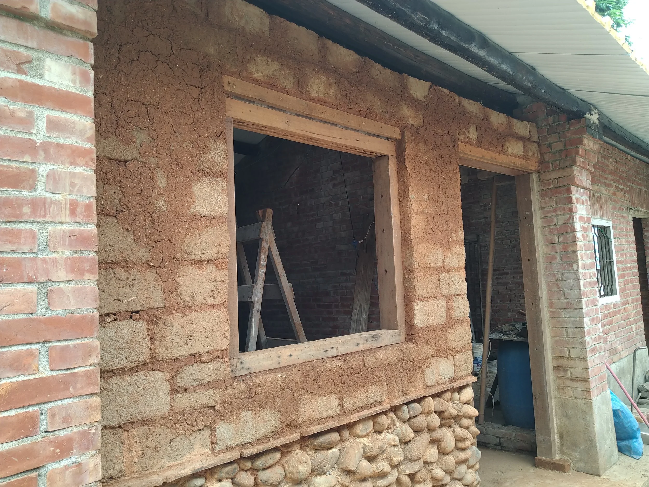 The raw adobe brick wall before applying the finish coat