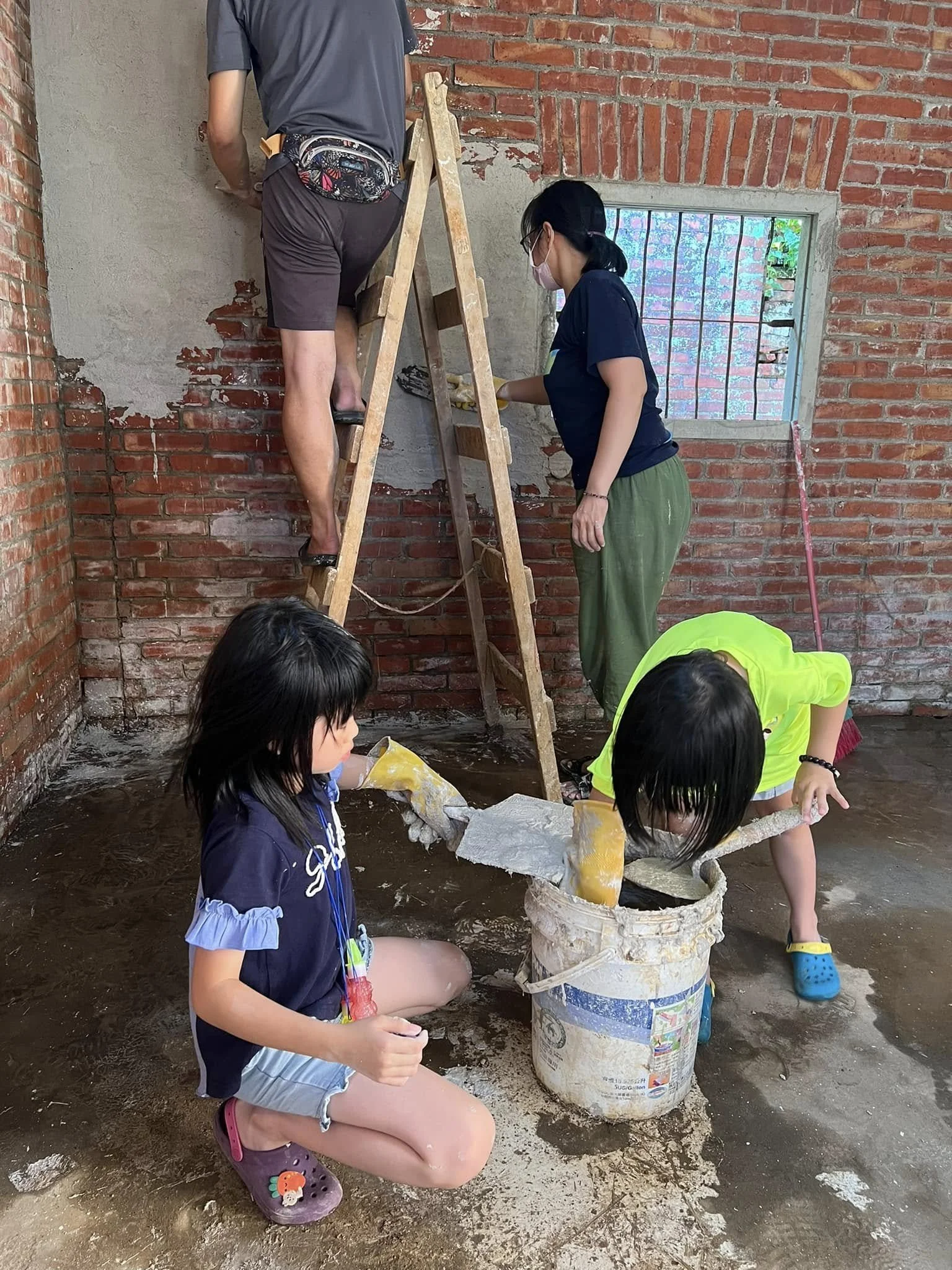 Applying our custom-blended lime plaster to the interior walls.