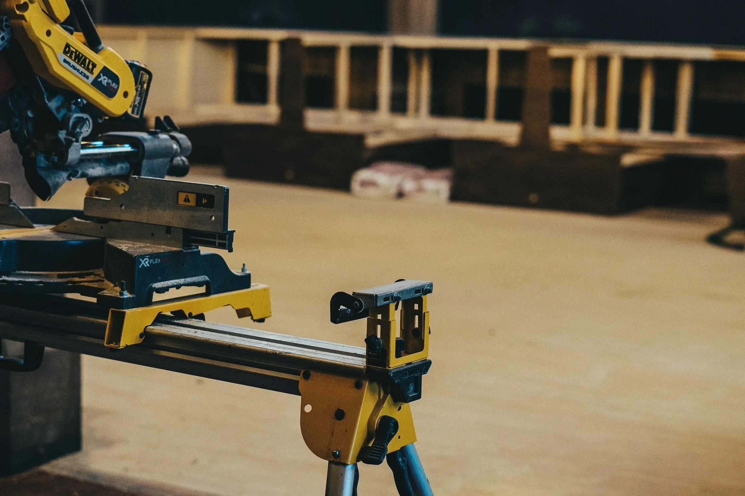 DeWalt mitre saw set up on a New Zealand construction site, representing My EstiMate's nationwide takeoff coverage