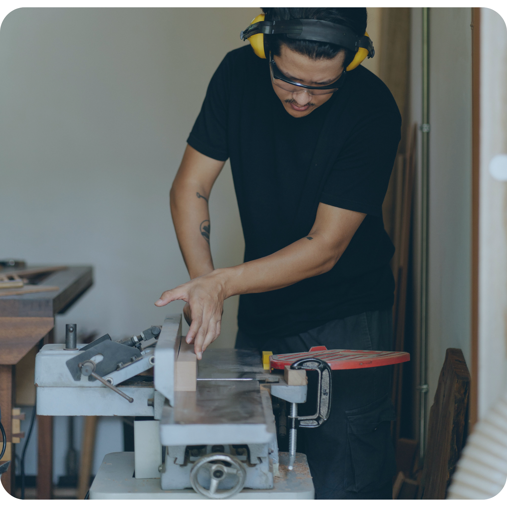Woodworker operating a bench jointer for internal carpentry alterations on a $190K residential development in Blenheim managed by My EstiMate.