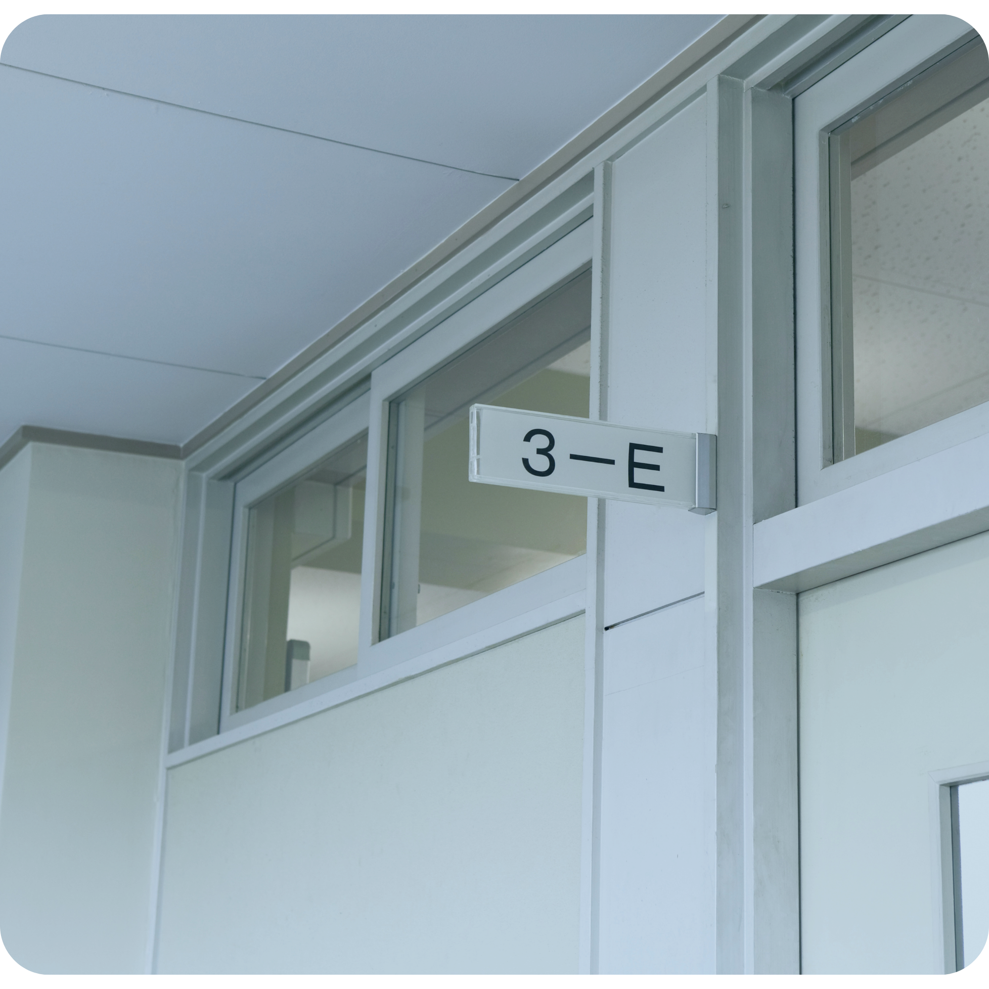 Commercial interior glass partition and room signage detail in an educational facility redevelopment project estimated by My EstiMate.