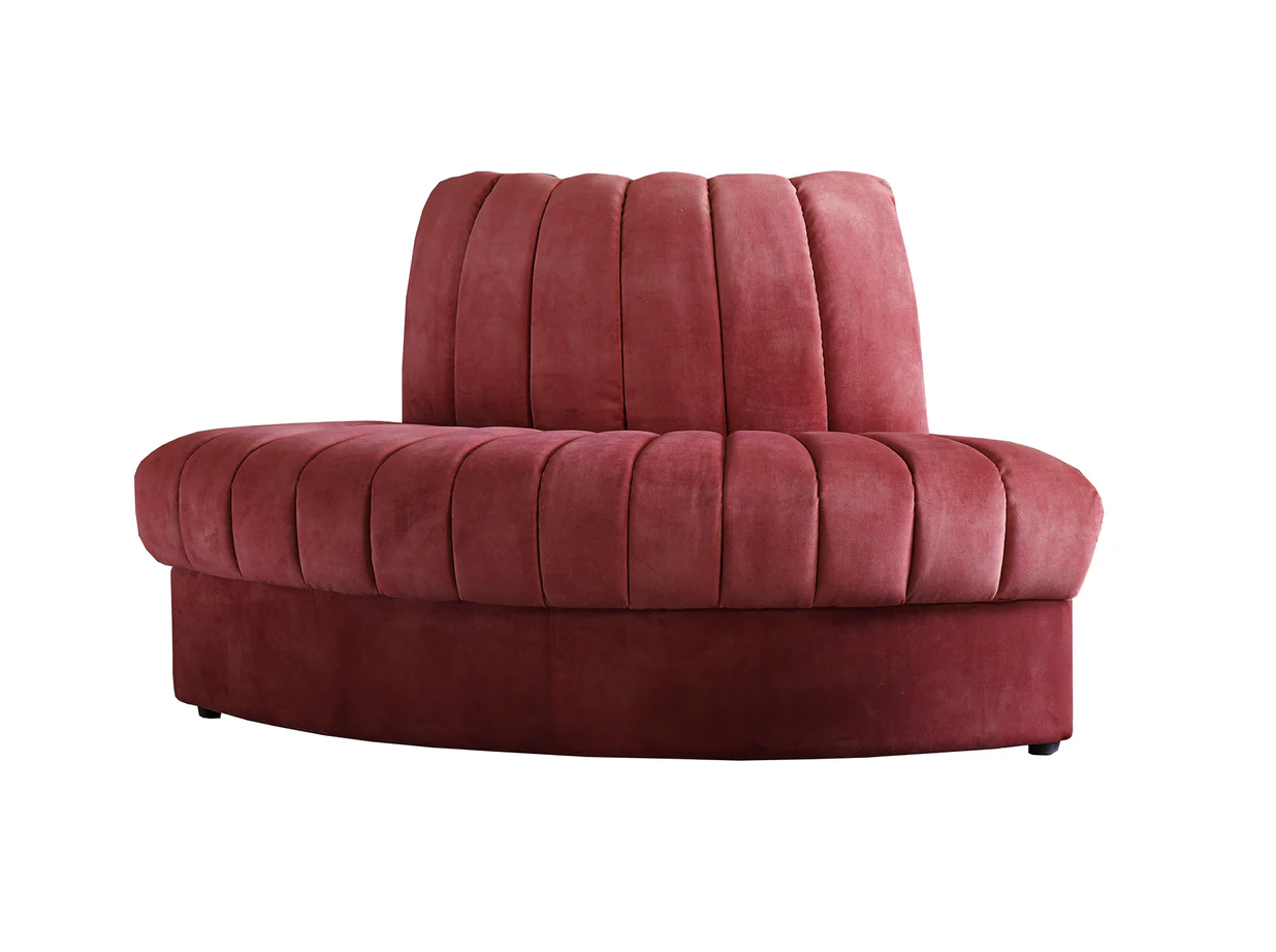 Red upholstered curved back and seat of a modern pet sofa or lounge chair.