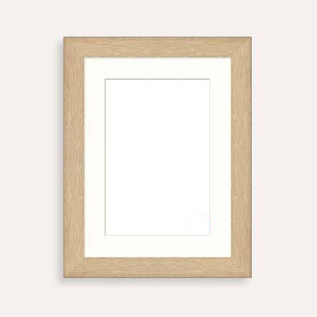 Empty picture frame with a wooden border hanging on a light-colored wall.