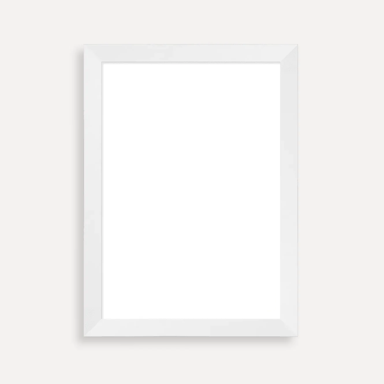 White picture frame with a blank white background, mounted on a wall.