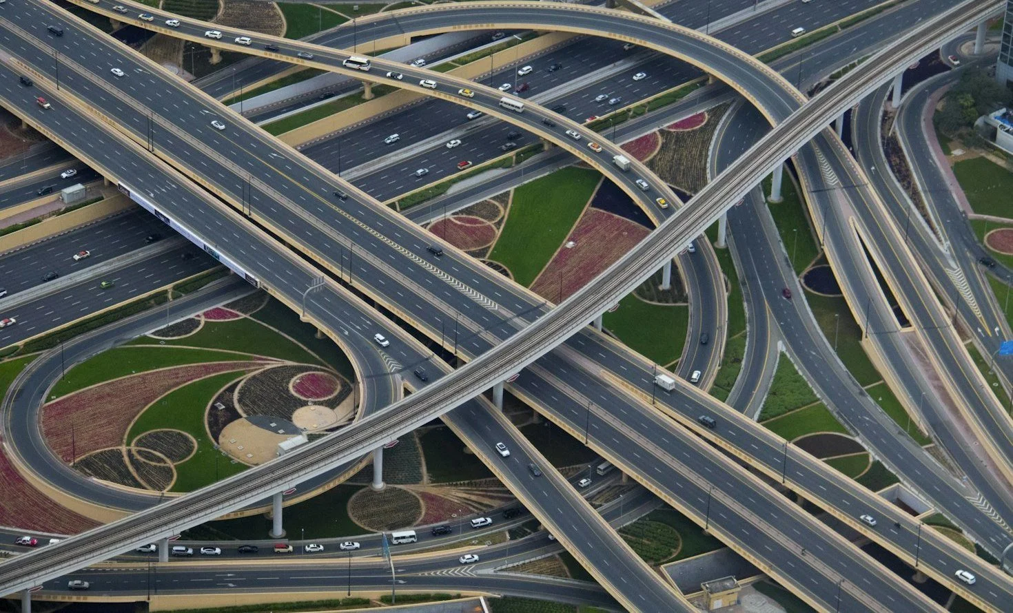 Road ramps and an elevated rail route crossing within a transport interchange.