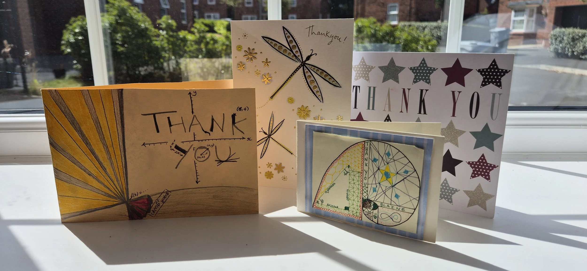 Collection of handwritten and illustrated thank-you cards from former maths students and families.