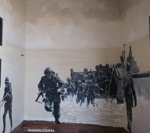 Street art painting of soldiers disembarking from a boat marked 'Guadalcanal' on a wall inside a room.