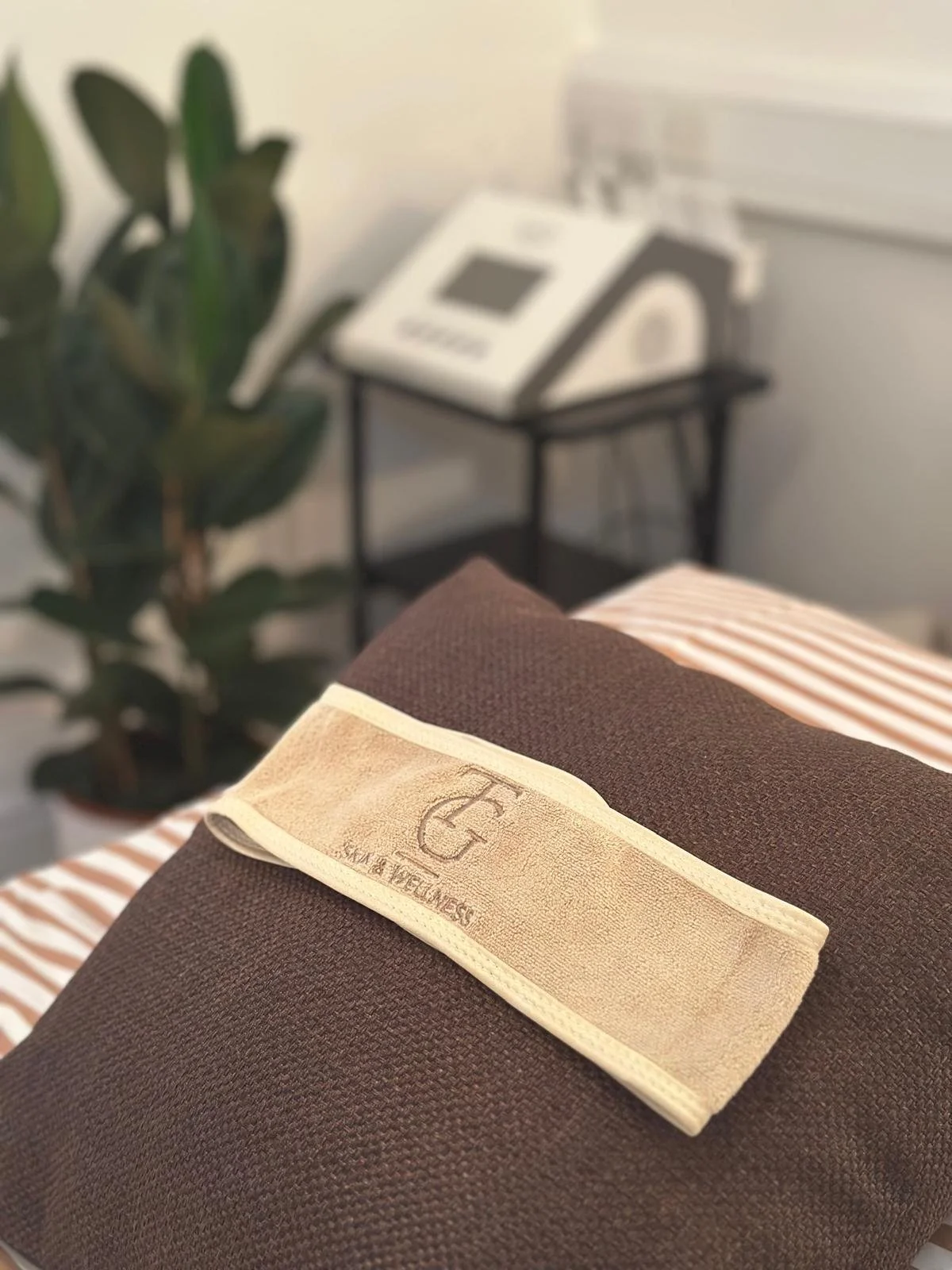 Massage treatment towels and wellness essentials at TG Skin & Wellness