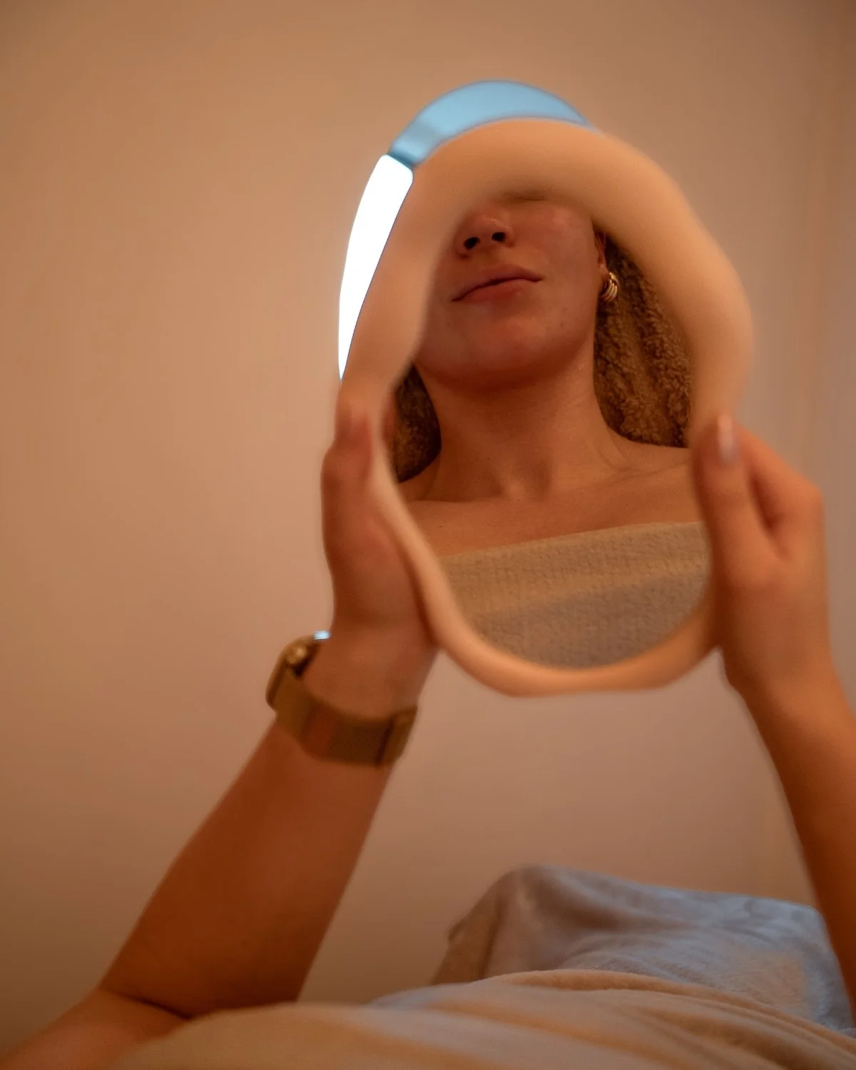 Client enjoying a relaxing skincare experience at TG Skin & Wellness
