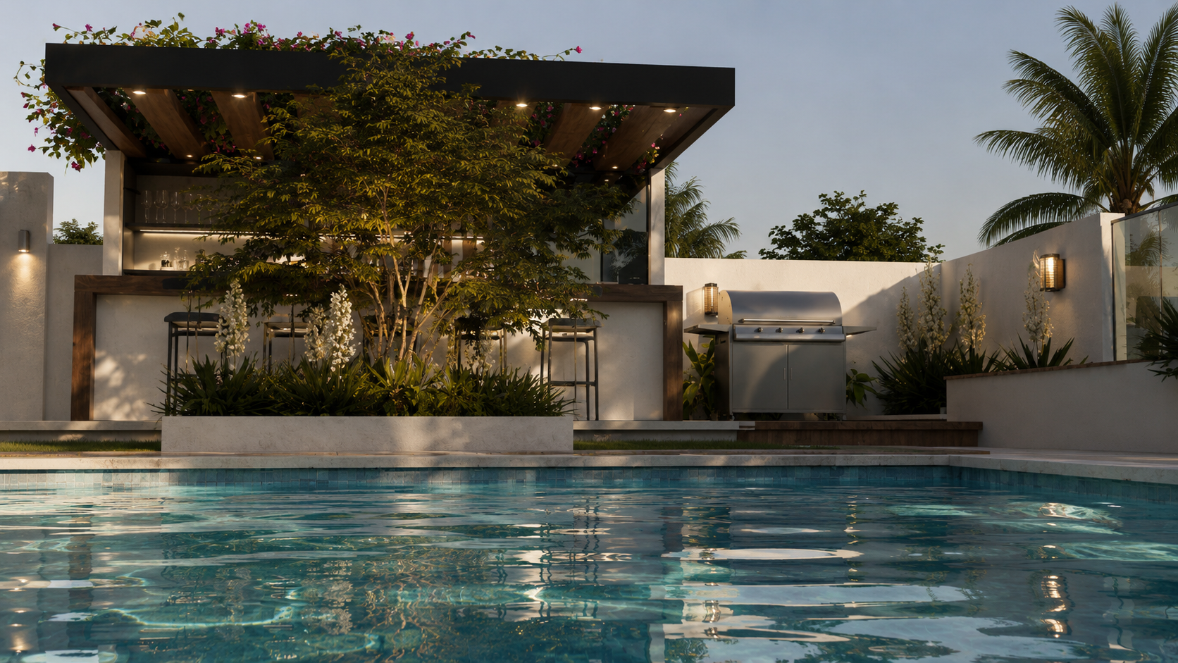 Modern backyard with a swimming pool, a grilling station, and a shaded bar area with seating amidst greenery, including a large tree and palm trees, at dusk.
