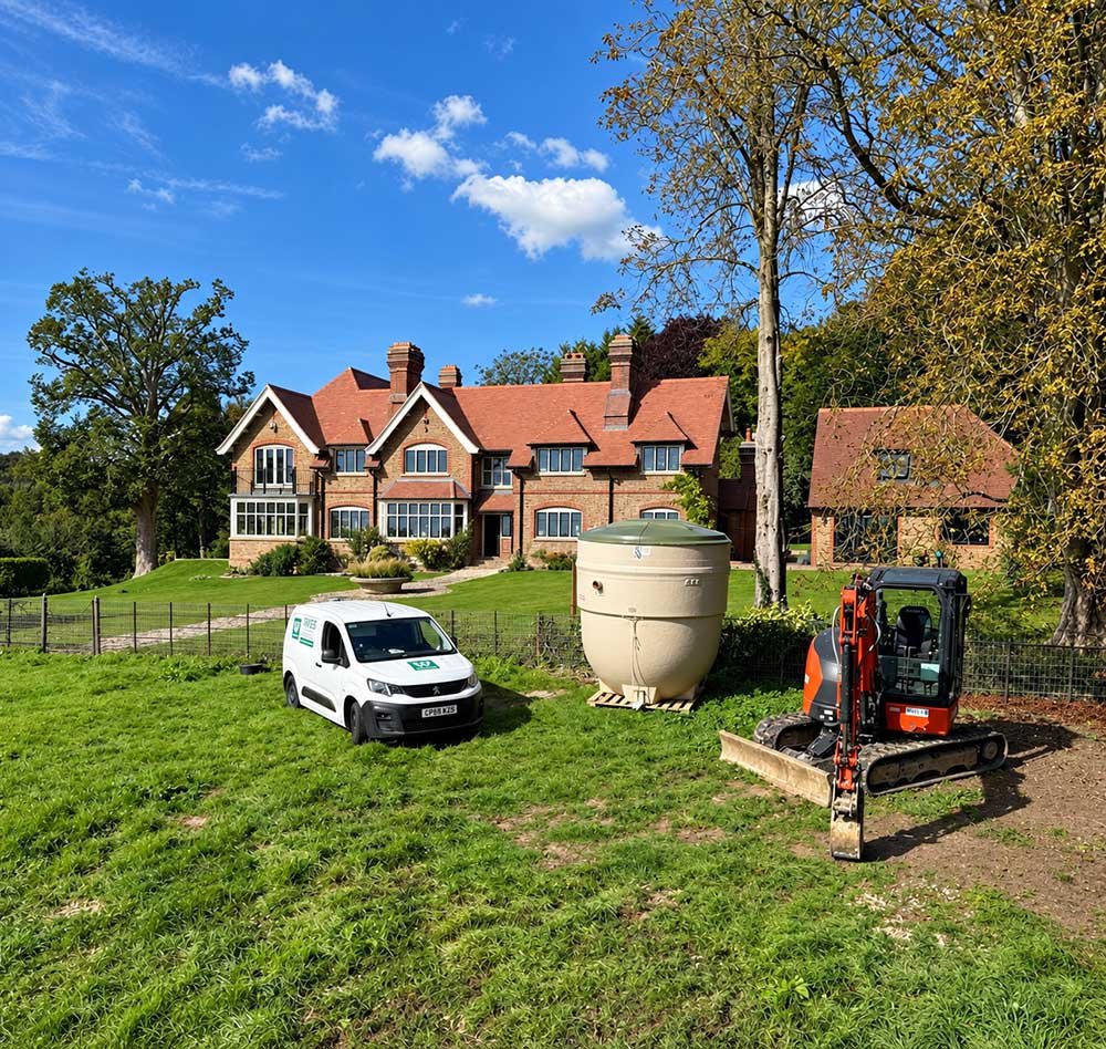 Treatment plant, WES van and excavator ready for installation at a property.
