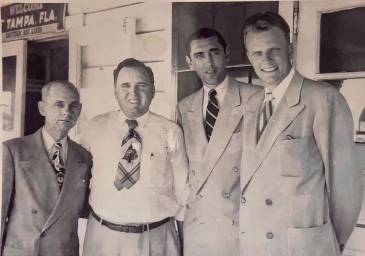 The Rev. Billy Graham, (R) and Rev. Charles Leaming, (2nd left) at the old Tampa Airport ,Eastern Airlines gate.