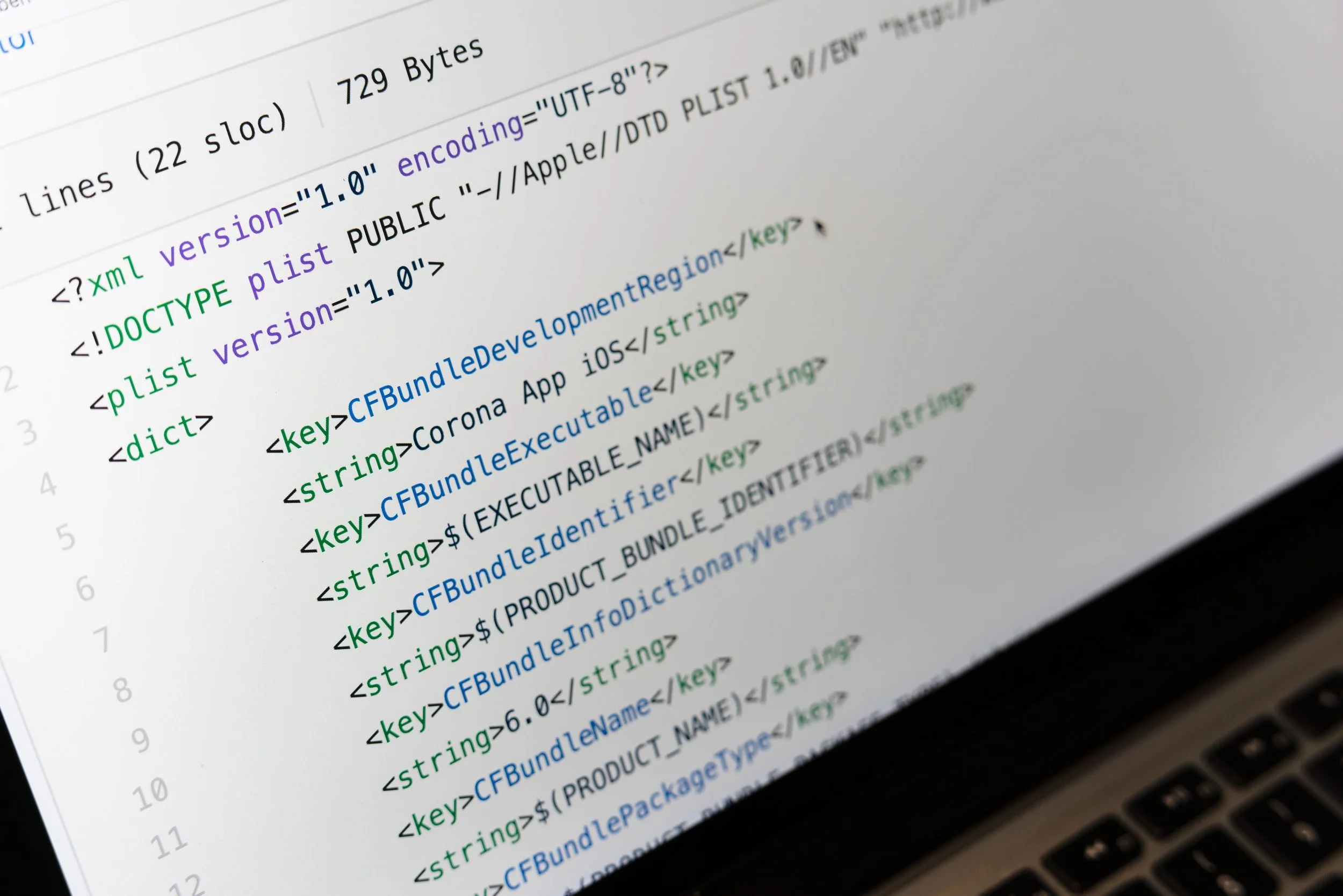 Capture d'écran d'un code informatique en XML avec des balises colorées sur un écran d'ordinateur.