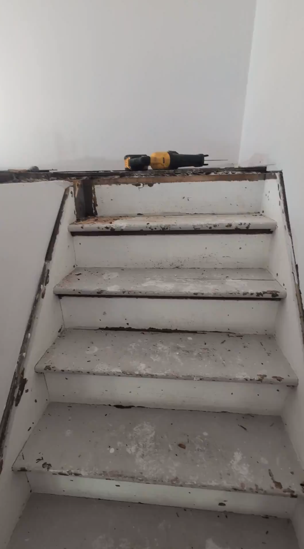BEFORE: Original staircase had to be left in place