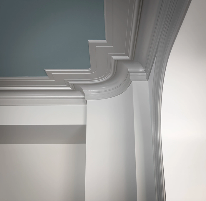 Interior detail showing crown molding and a blue painted ceiling.