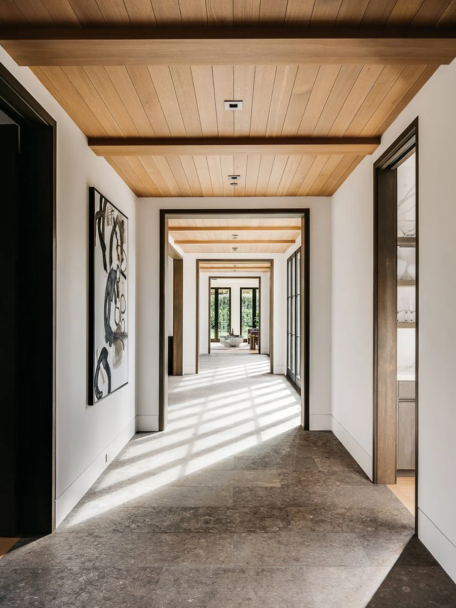 Interior passage connecting rooms and framing views of the landscape.