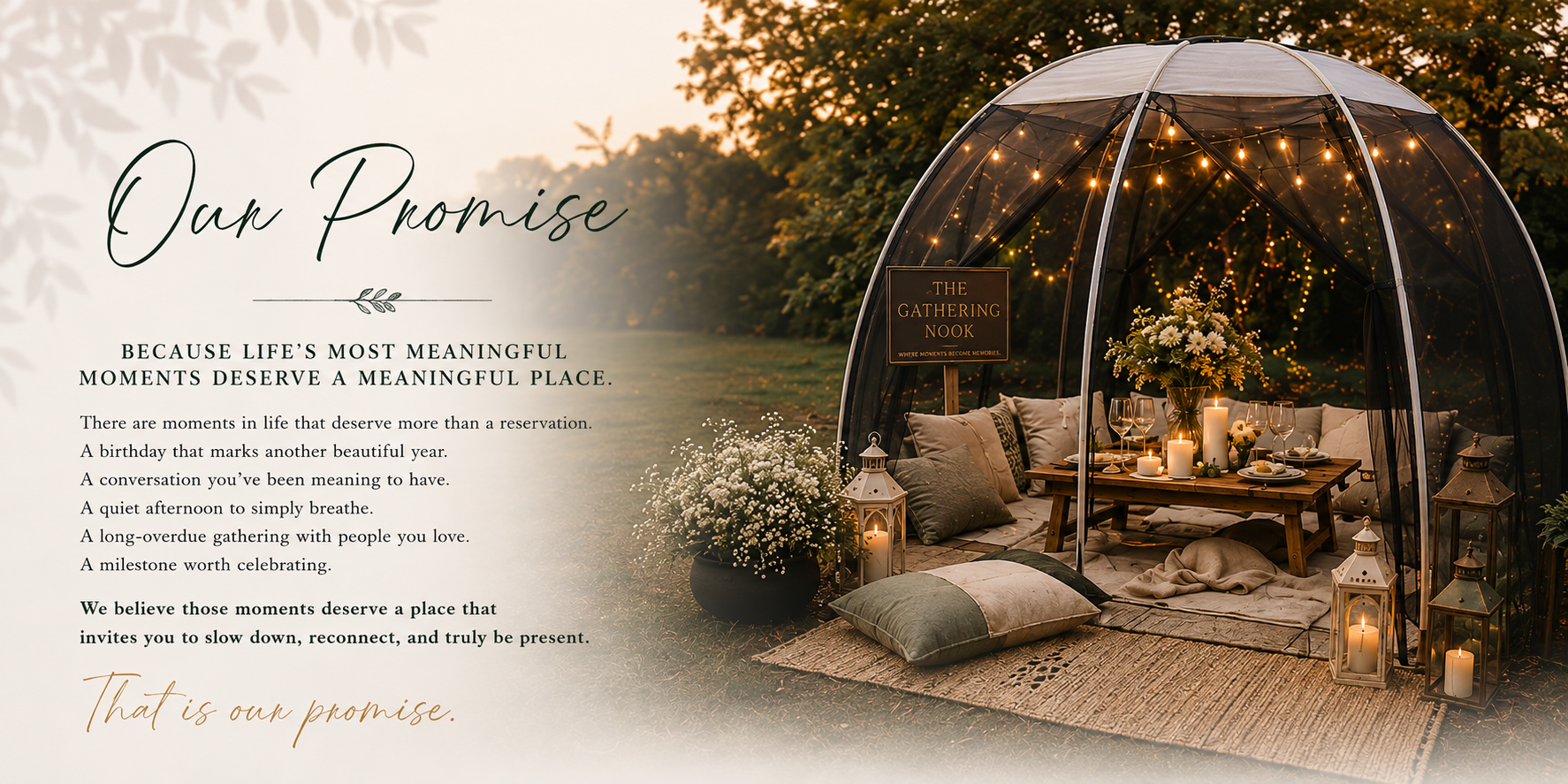 An outdoor dining setup under a transparent dome with string lights and candles, featuring a wooden table with floral arrangements and pillows, surrounded by lanterns and greenery at sunset.