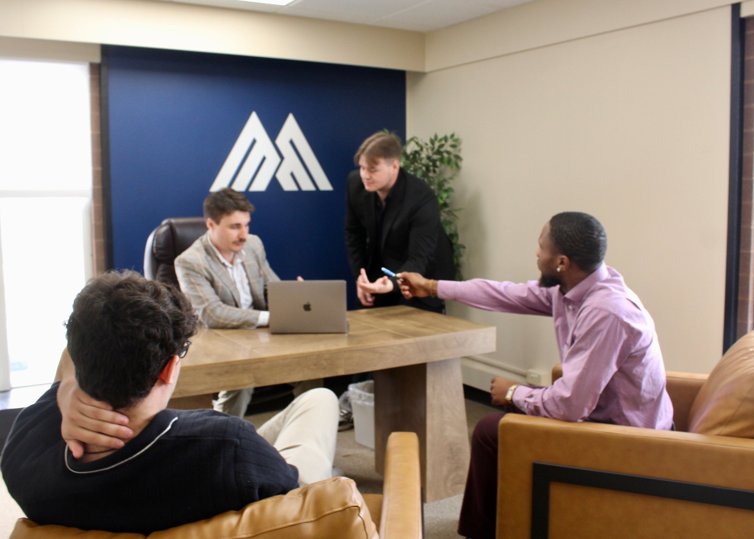 skye client solutions team meeting in the office.