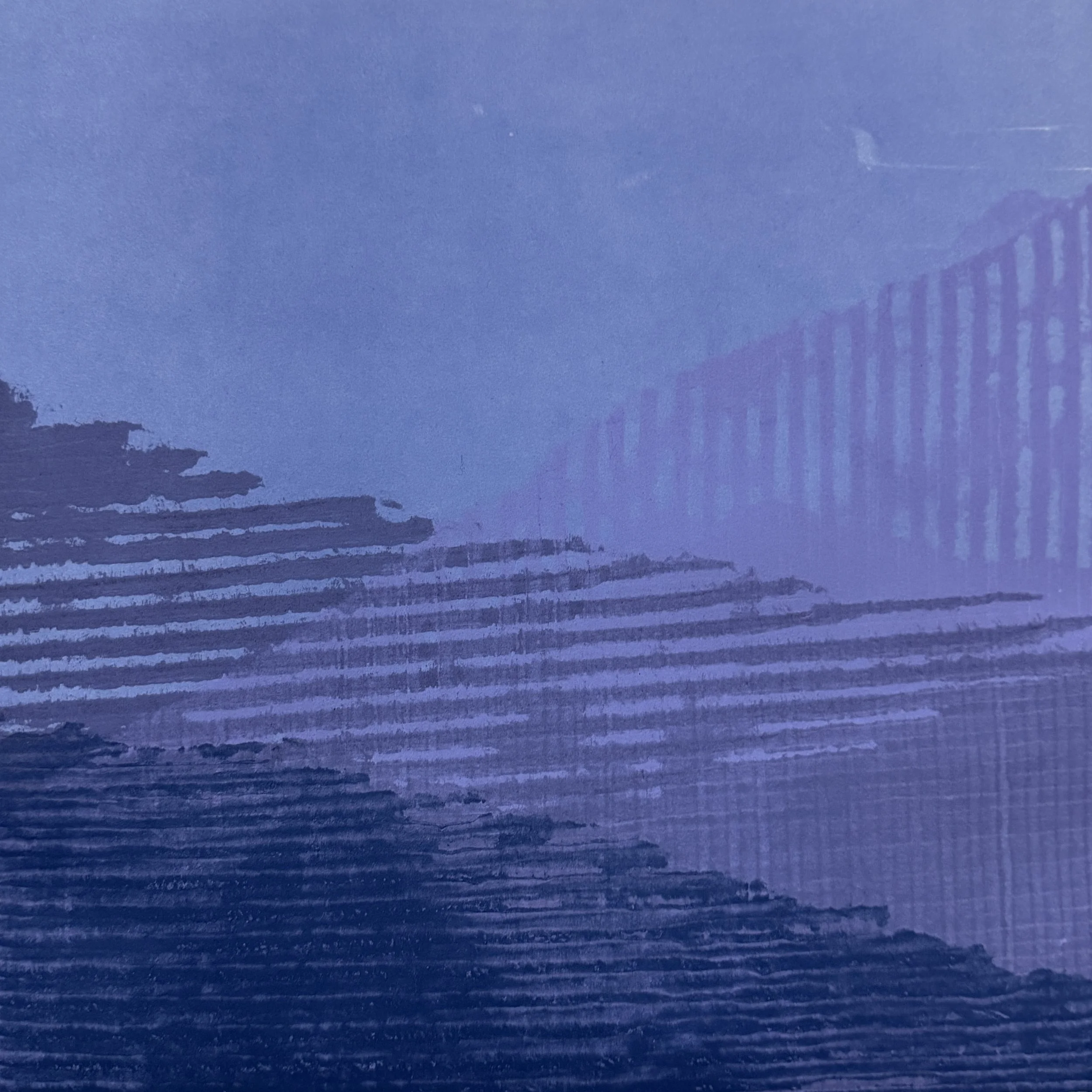 Close-up of a blue painted wooden surface with horizontal brush strokes and a shadow of a fence in the lower right corner.