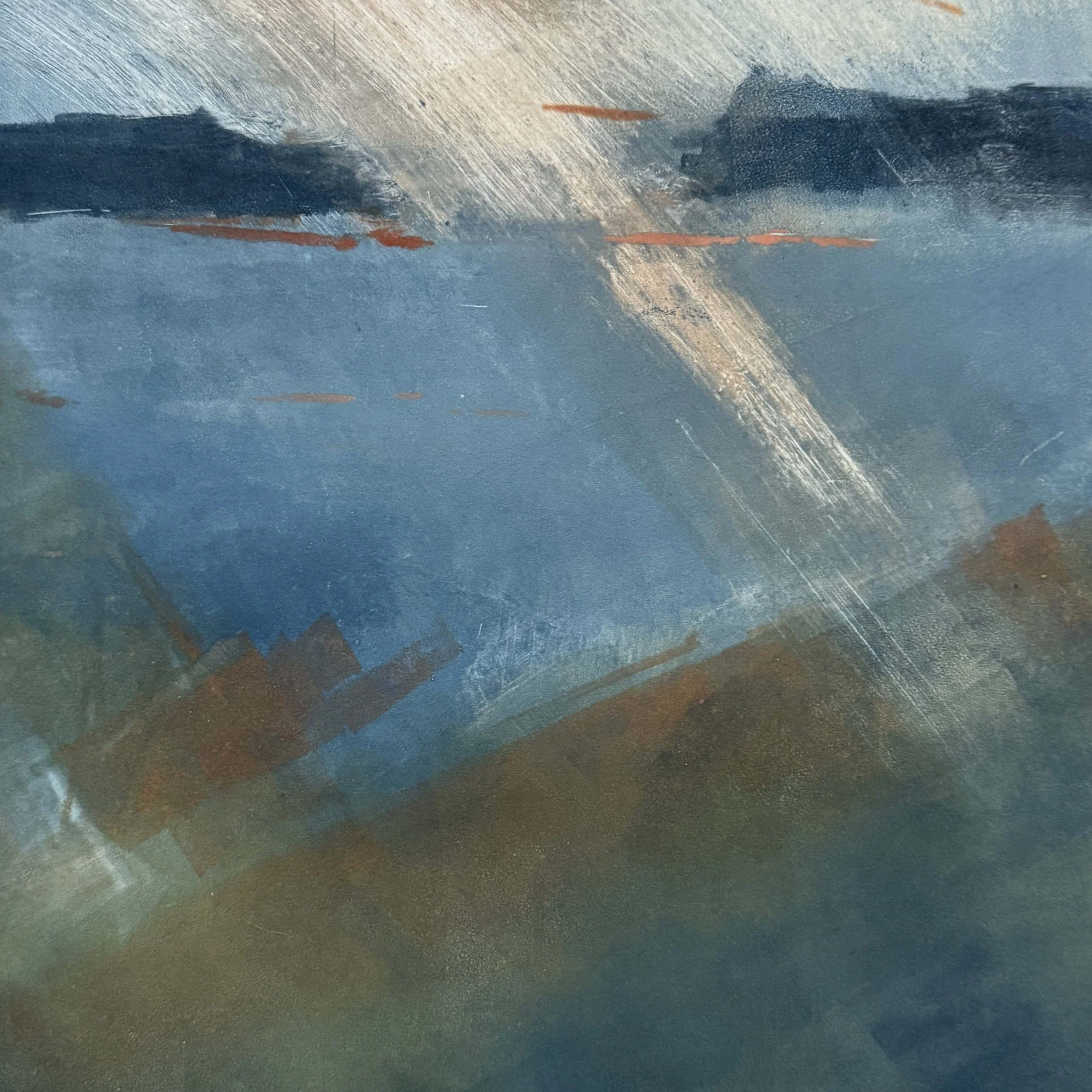 Close-up of a textured metallic surface with blue and bronze hues, streaks, and scratches.