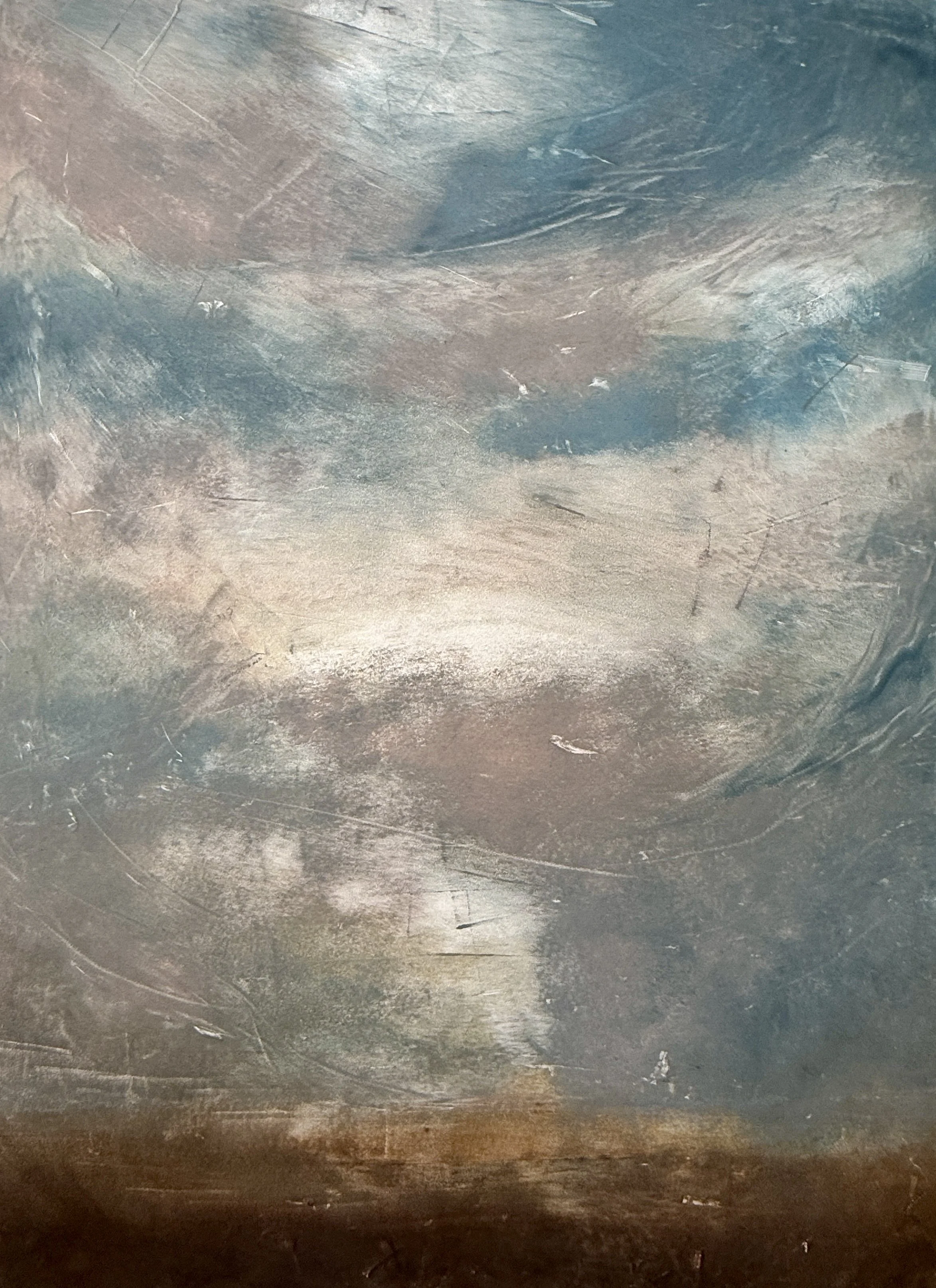 Close-up photograph of a metallic surface with scratches and a brushed texture, exhibiting a gradient of dark to lighter shades of gray and silver.