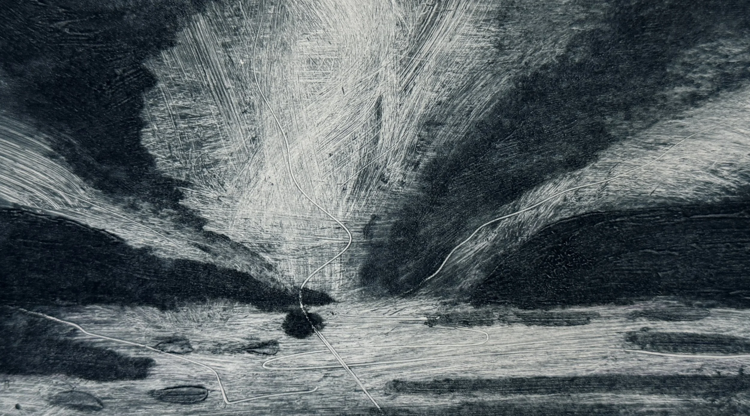 A close-up black and white photograph of textured, worn surface with visible scratches and lines.