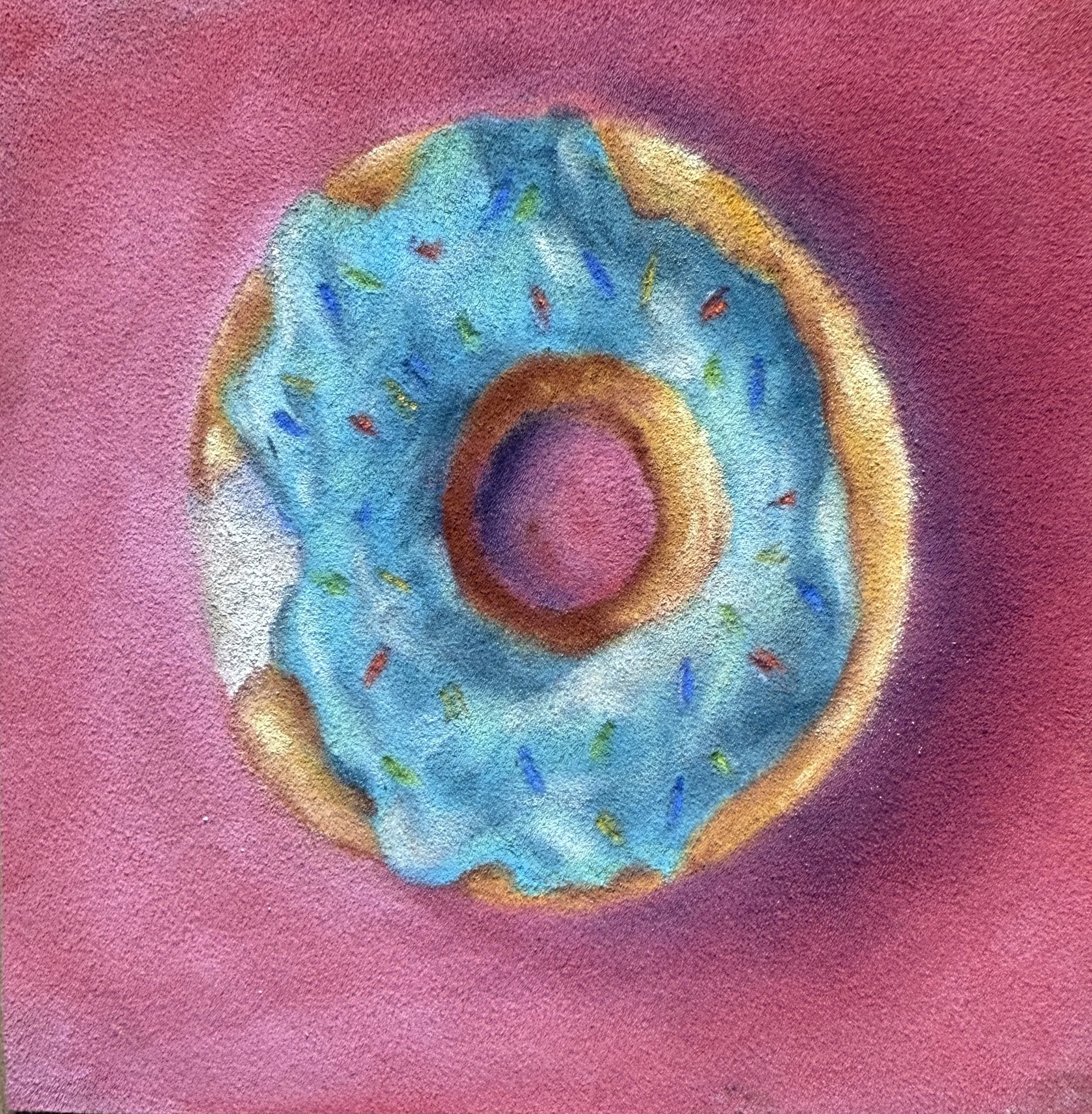 Close-up of a swirl-shaped object with pastel colors, including shades of blue, brown, and purple, on a pink textured background.