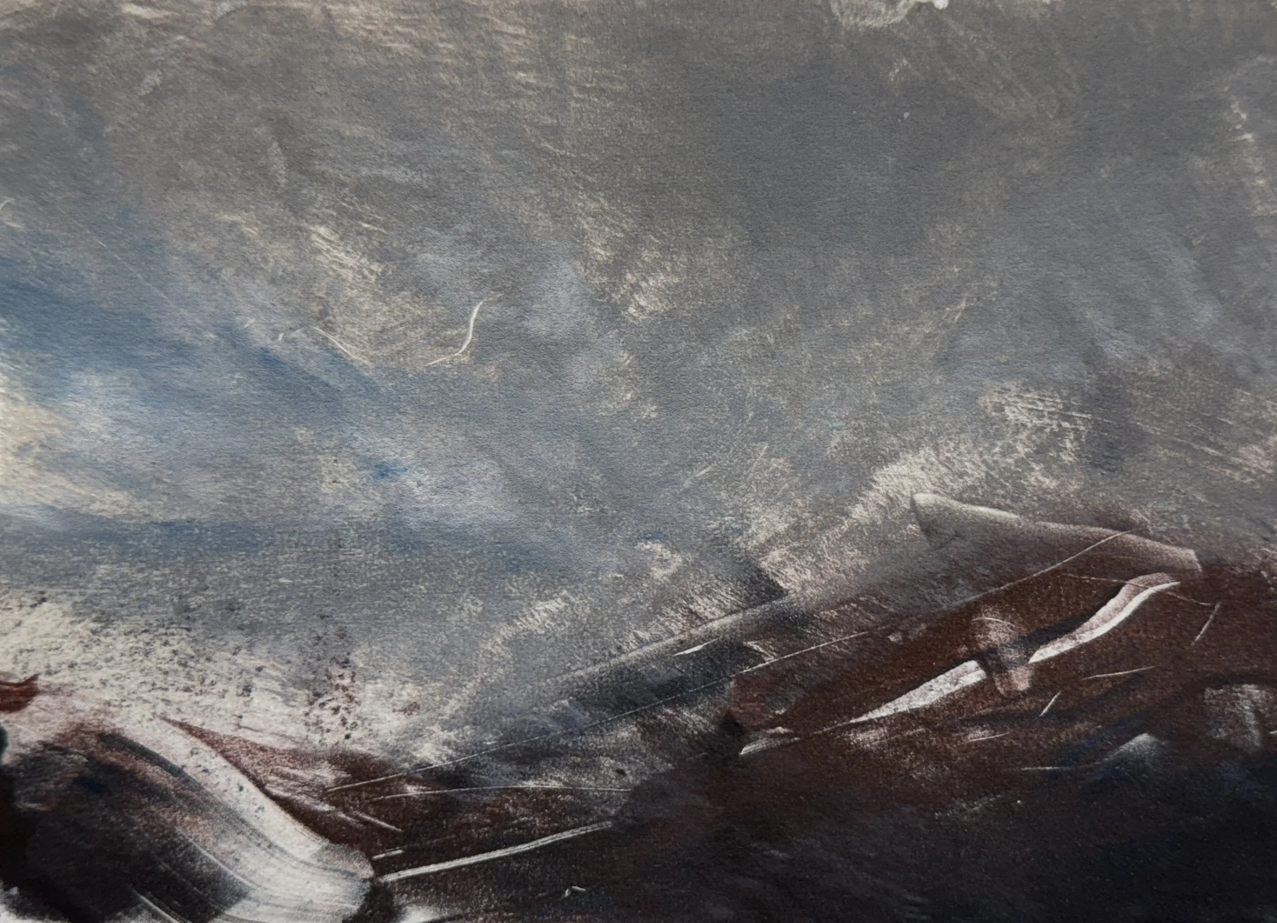 Close-up of a dark, textured surface with some lighter streaks and areas of rust or discoloration.
