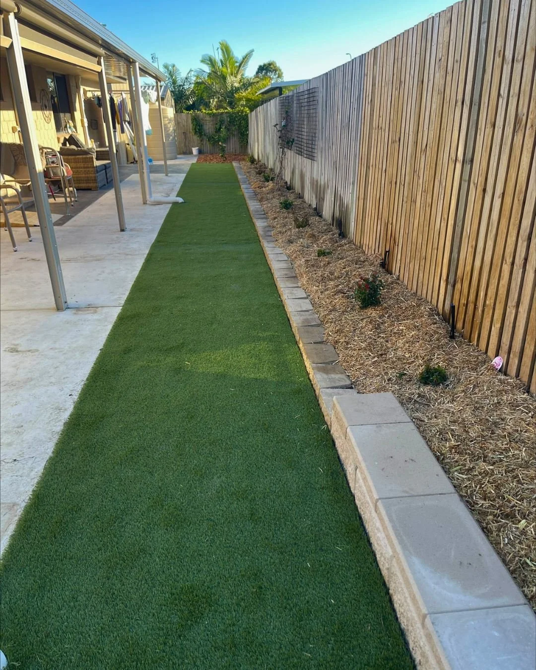 Artificial turf installation and retaining wall garden