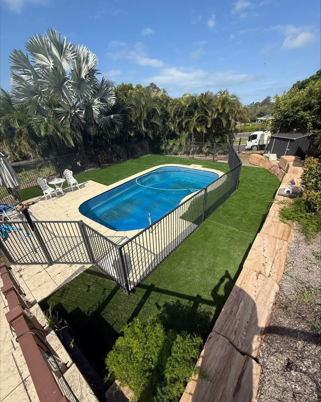 Artificial turf installed around pool