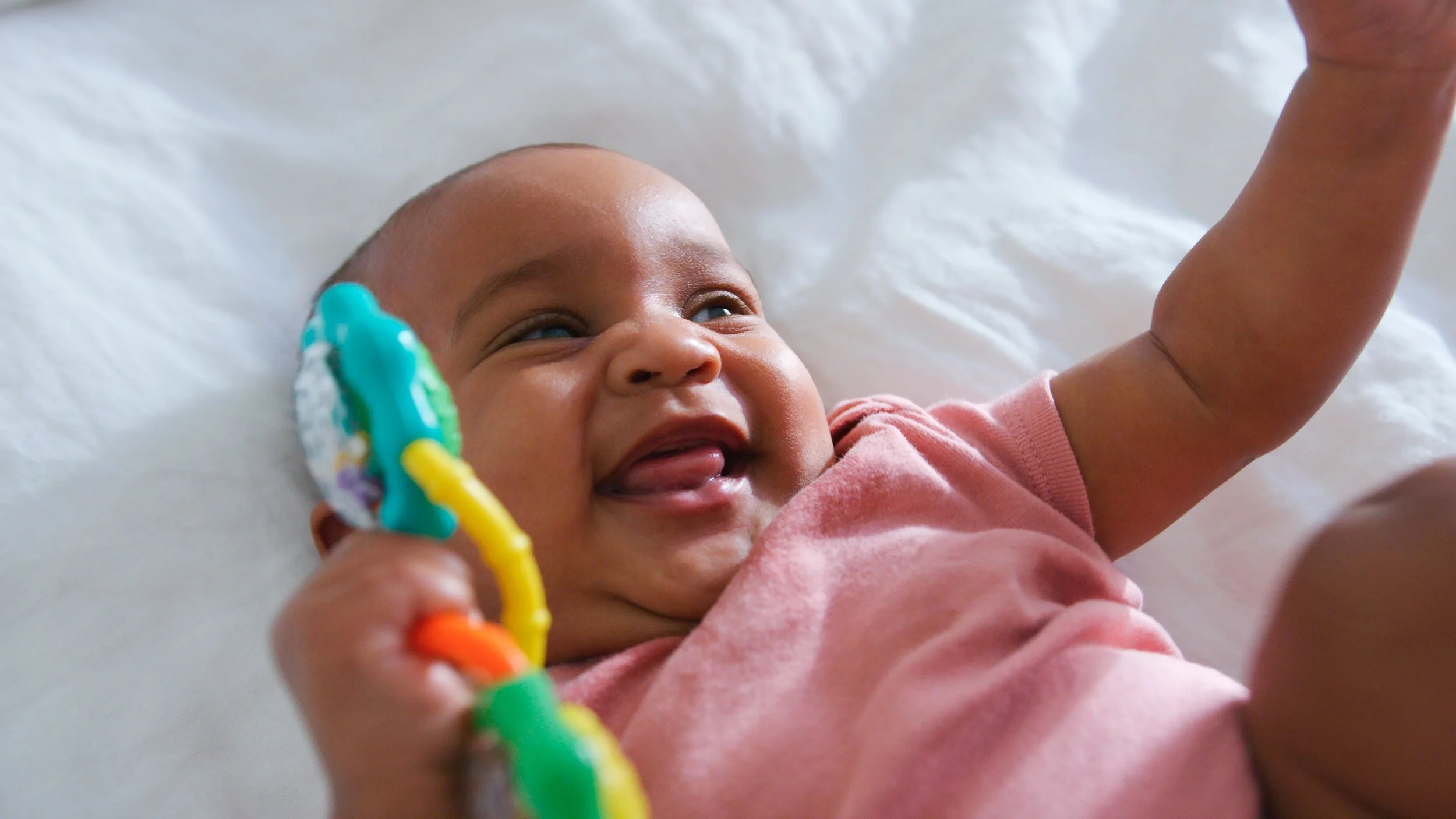 Infant care with happy baby girl.
